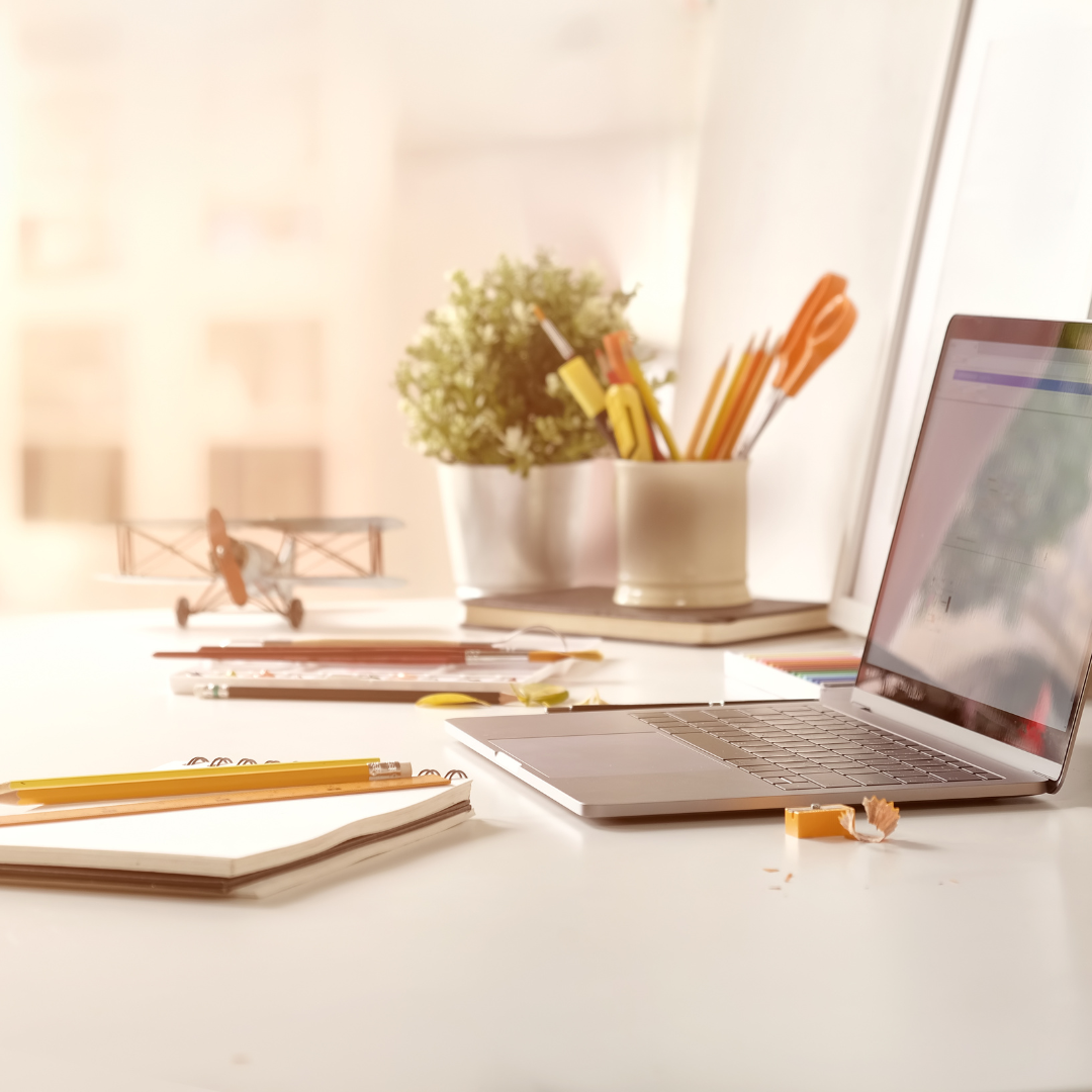 MacBook Pro near white open book